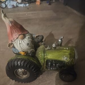 Whimsical Gnome on Green Tractor Figurine